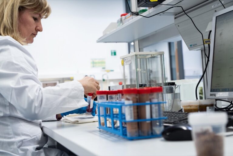 Scientist verifying dog probiotic label claims against lab analysis