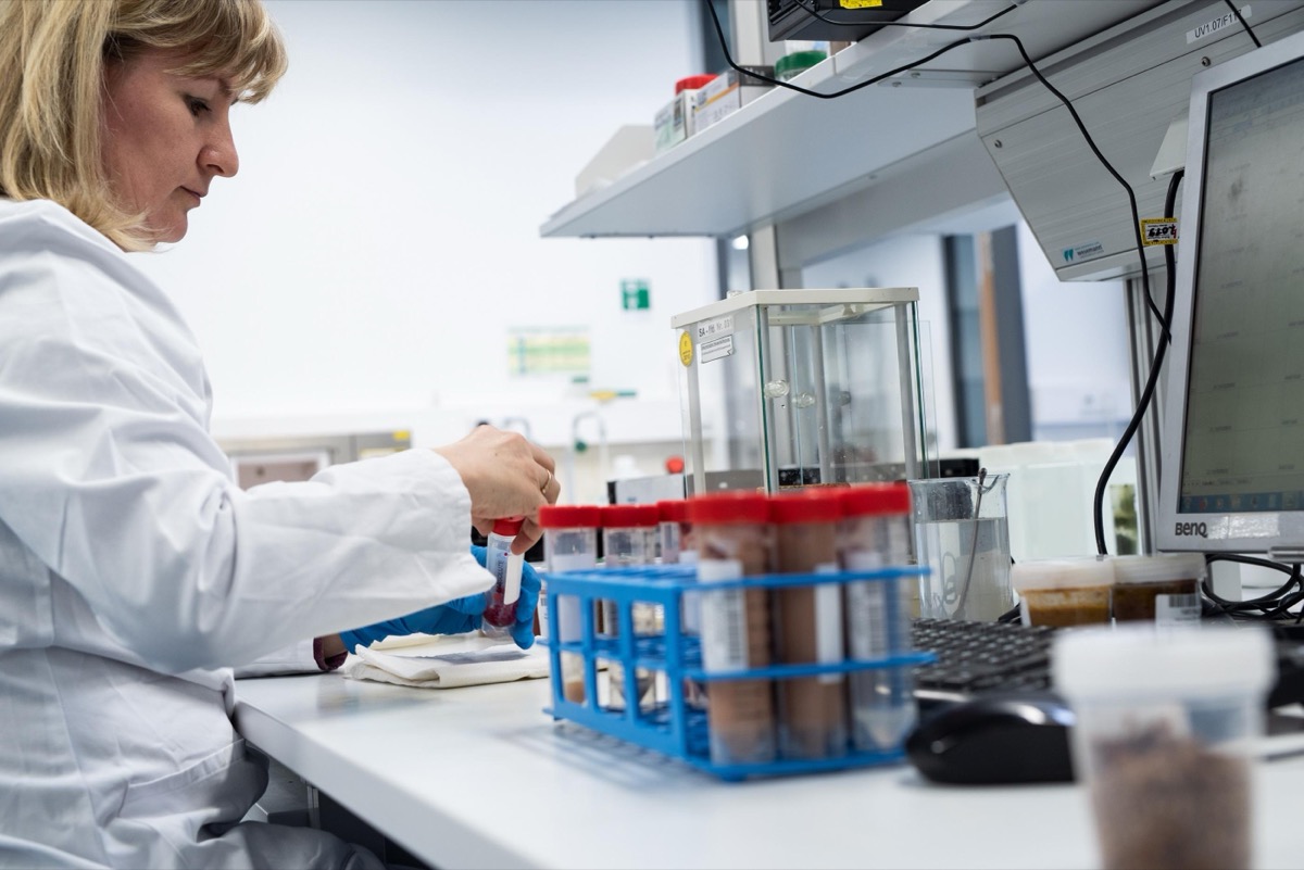 Scientist verifying dog probiotic label claims against lab analysis